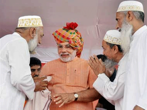 Some members of the minority community in Bangalore questioned BJP&#8200;prime ministerial candidate Narendra Modi's decision not to wear a skull cap offered to him by a Muslim cleric during a public rally in Gujarat in 2011. Modi during his Sadbhavana yatra. PTI File Photo