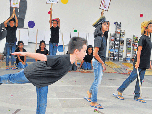 Students of Mallya Aditi International School stage a play on 'disappearing' lakes, in the City on Saturday. DH Photo