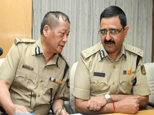 A host of priests, members of Catholic Kannada organisations and Karnataka Kannada Dharmagurugala Balaga on Saturday demanded a Central Bureau of Investigation (CBI) probe into the murder of Rector K J Thomas of St Peter Pontifical Seminary at Malleswaram last year. IG & DGP Lalrokhuma Pachuau (left) having a word with Police Commissioner Raghavendra Auradkar at the press conference called to informing about St. Peter Seminary Rector Fr. Thomas murder case which was cracked by police. DH Photo