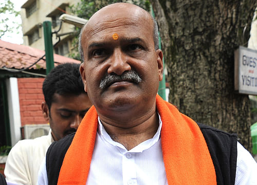 Controversial chief of right wing outfit Sri Ram Sena, Pramod Muthalik, who was linked with the attack on women at a pub in Mangalore in 2009, joined the BJP here today.  DH photo