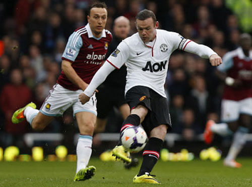 Wayne Rooney scored twice, the first an astonishing 58-metre volleyed contender for Goal of the Season, as Manchester United won their second game in four days by brushing aside West Ham United 2-0 at Upton Park on Saturday, AP photo