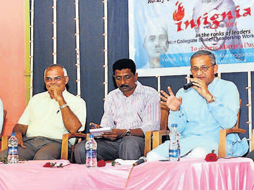 MLC Capt Ganesh Karnik speaks at a panel discussion with the parliament election candidates or their representatives and students at Insignia-2104, a workshop for youth, at Rotary Bal Bhavan in Mangalore on Sunday. AAP candidate M R Vasudeva, Prof P L Dharma, M G Hegde and JD(S) representative Shrikanth Rai look on. DHNS