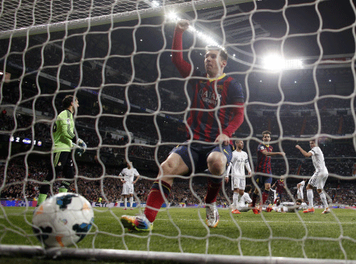 Barcelona's Lionel Messi celebrates his goal against Real Madrid during La Liga's second 'Clasico' soccer match of the season at Santiago Bernabeu stadium in Madrid March 23, 2014. REUTERS