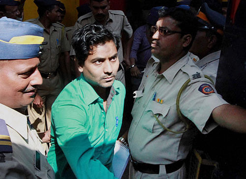 One of the four men convicted for gang raping a photojournalist at Shakti Mills compound last year, is taken to the Session Court from Arthur Road Jail in Mumbai on Monday. PTI Photo