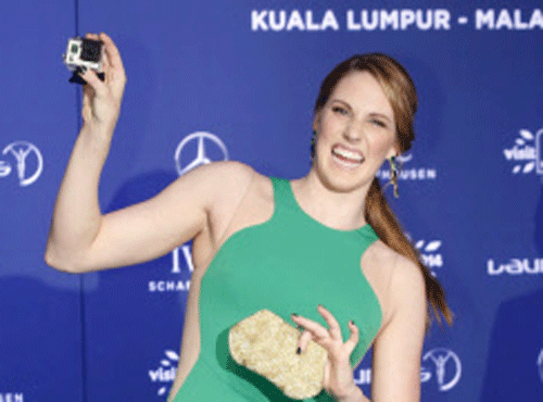 Formula One world champion Sebastian Vettel and American swimming sensation Missy Franklin were named Laureus Sportsman and Woman of the Year on Wednesday in a ceremony filled with tributes to those affected by the missing Malaysian Airlines plane, Re