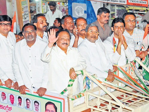 Chief Minister Siddaramaiah, Rizwan Arshad, Congress candidate for Bangalore Central constituency, ministers R Roshan Baig, Dinesh Gundu Rao and others take part in a road show in Bangalore on Wednesday. DH Photo