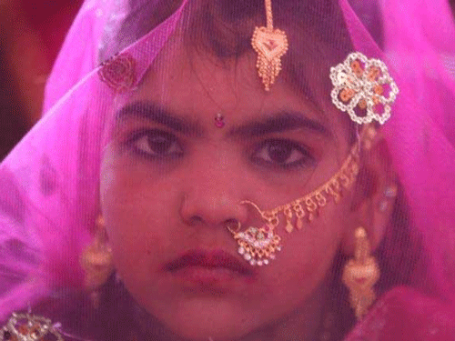 To mobilise public opinion against child marriages, an NGO today kickstarted a 'No Child Brides' campaign here by unveiling an interactive art installation fashioned out of thousands of white bindis. / Reuters file image for representation only