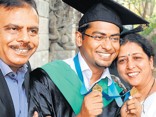 Ritesh Agarwal, who won two gold medals, poses with his parents Ashok Agarwal and Manjula Agarwal, at the Indian Institute of Management, Bangalore, convocation on Thursday. DH Photo