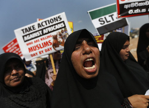 A group of Sri Lankan Muslim women shout slogans, protesting against the UN and U.S resolution against Sri Lankan war crimes, during a demonstration as they march towards U.S embassy in Colombo March 26, 2014. Sri Lanka questioned the independence of the human rights office of the United Nations on March 5, a day after the United States asked the U.N. to investigate human rights violations by the Sri Lankan government.The U.S. resolution calls for the U.N.'s Human Rights Council to investigate 'past abuses and to examine more recent attacks on journalists, human rights defenders, and religious minorities.' REUTERS