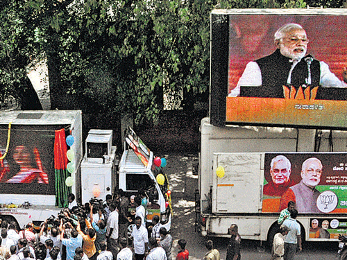 The BJP on Friday launched  modified trucks with LED screens to highlight the achievements of the  party's prime ministerial candidate Narendra Modi. DH Photo