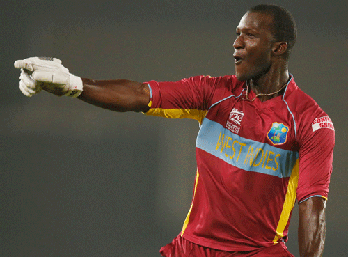 West Indies' captain Darren Sammy celebrates his team's win over Australia in the ICC Twenty20 Cricket World Cup match in Dhaka, Bangladesh, Friday, March 28, 2014. West Indies' won the match by six wickets. (AP Photo)