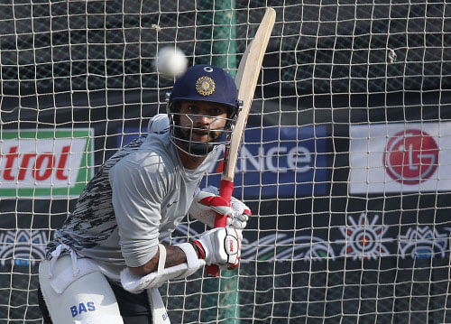 India's Shikhar Dhawan bats in the nets during a training session ahead of their ICC Twenty20 Cricket World Cup match against Australia in Dhaka, Bangladesh, Saturday, March 29, 2014. AP photo