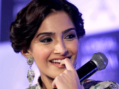 Actress Sonam Kapoor, who has again teamed up with her actor-father Anil Kapoor and sister Rhea in 'Khoobsurat' says that it is not easy to work with family members / PTI file photo