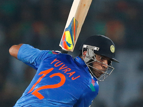 India's batsman Yuvraj Singh prepares to play a shot during their ICC Twenty20 Cricket World Cup match against Australia in Dhaka, Bangladesh, Sunday, March 30, 2014. (AP Photo/Aijaz Rahi)