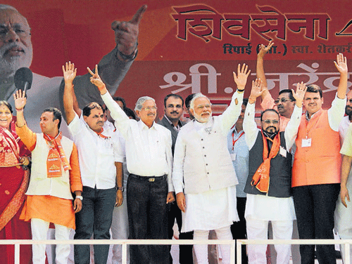 BJP's prime ministerial candidate Narendra Modi with BJP-Shiv Sena leaders during their joint rally on Sunday. PTI