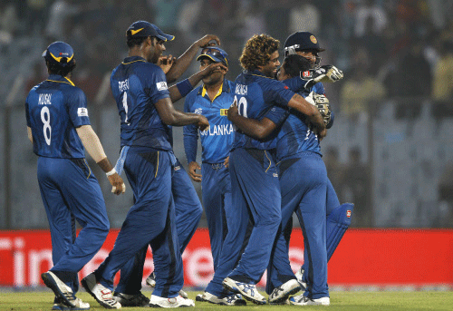 Sri Lanka's players celebrates their victory against New Zealand during their ICC Twenty20 Cricket World Cup match in Chittagong, Bangladesh, Monday, March 31, 2014. Sri Lanka won by 59 runs. AP photo