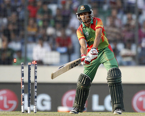 Bangladesh's Nasir Hossain is bowled out during their ICC Twenty20 World Cup match against Australia in Dhaka. Reuters.