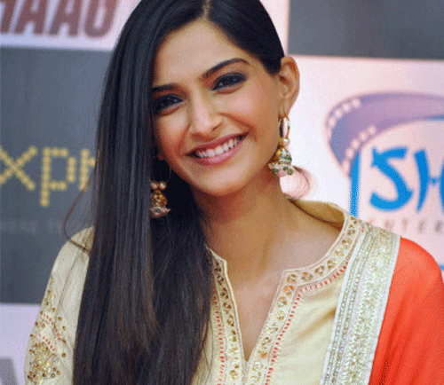 Actress Sonam Kapoor, who has once again teamed up with her actor-father Anil Kapoor and sister Rhea in Khoobsurat after 'Aisha', says it's not easy to work with family members. PTI file photo