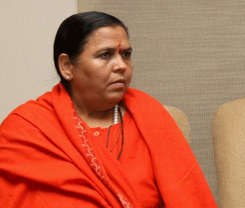 A day after BJP fielded lawyer Ajay Agarwal from Rae Bareli, party leader Uma Bharti today said she was willing to contest against Sonia Gandhi but without giving up Jhansi where she was nominated much earlier. PTI photo