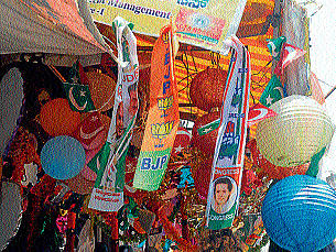 Buntings of all major political parties hanging outside a shop in Mysore, on Monday.