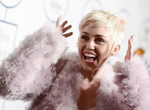 Pop star Miley Cyrus is courting controversy yet again after a new image of her baring her body for an official photoshoot leaked online. / AP file photo