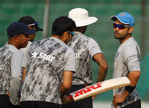 Virat Kohli, right, and his teammates attend a training session ahead of their ICC Twenty20 Cricket World Cup semifinal match against South Africa in Dhaka, Bangladesh, Wednesday, April 2, 2014. AP