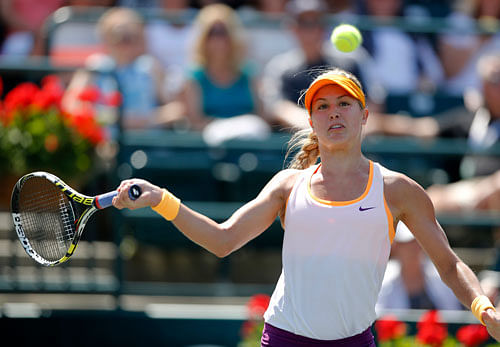 Eugenie Bouchard, of Canada, returns to Venus Williams during the Family Circle Cup tennis tournament in Charleston, S.C., Thursday, April 3, 2014. AP