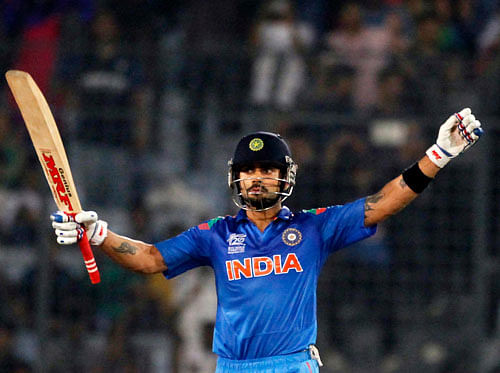 Virat Kohli celebrates after India won the semi final match against South Africa in the ICC Twenty20 World Cup at the Sher-E-Bangla National Cricket Stadium in Dhaka April 4, 2014. REUTERS