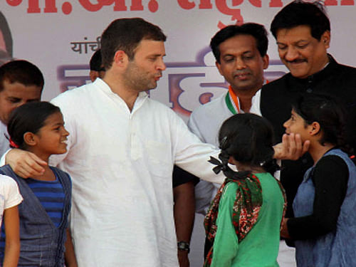 Congress Vice President Rahul Gandhi with children at an election rally in Wardha, Maharashtra, PTI file Photo