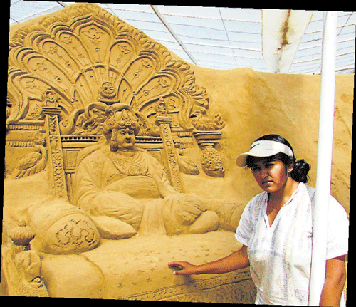 M N Gowri is seen with one of her creations depicting erstwhile Maharaja of Mysore, Srikantadatta Narasimharaja Wadiyar, in Mysore.  dh photos