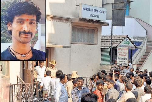 crime scene: A crowd gathers in front of the studio where Hanumanth Kattimani (inset) was found strangled in the City on Saturday. dh photo