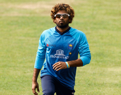 Sri Lanka's captain Lasith Malinga stretches during a training session ahead of their ICC Twenty20 Cricket World Cup final match against India in Dhaka, Bangladesh, Saturday, April 5, 2014. AP Photo