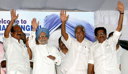 Prime Minister Manmohan Singh with Congress candidate K V Thomas and Kerala Chief Minister Oommen Chandy and V M Sudheeran during an the Election meeting in Kochi on Sunday. PTI Photo