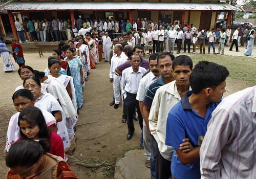 Voters line up to cast their vote outside a polling station in Nakhrai village in Tinsukia district, in the northeastern Indian state of Assam April 7, 2014. The first electors cast their votes in the world's biggest election on Monday with Hindu nationalist opposition candidate Narendra Modi seen holding a strong lead on promises of economic revival and jobs but likely to fall short of a majority. REUTERS
