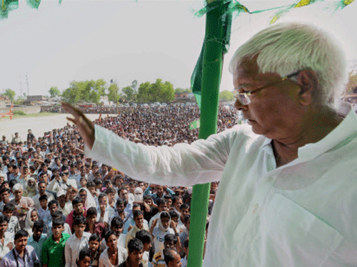 Amid speculation about fissures in RJD-Congress alliance in Bihar, RJD President Lalu Prasad campaigned for Speaker Meira Kumar here and said unity among the two 'secular' parties would keep communal forces away from power. PTI Photo