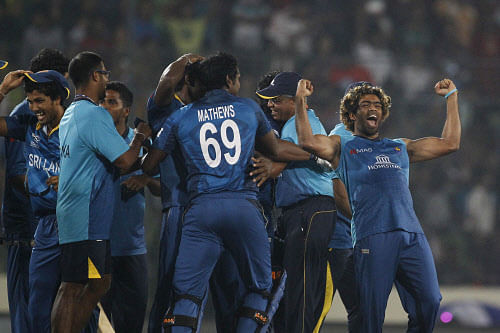 Sri Lanka's captain Lasith Malinga, right, and teammates celebrate after winning the ICC Twenty20 Cricket World Cup in Dhaka, Bangladesh. AP Photo