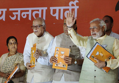 Bharatiya Janata Party's (BJP) Prime Ministerial candidate Narendra Modi (R), Party President Rajnath Singh (C), and senior leader Lal Krishna Advani and Sushma Swaraj at the release of the party's election manifesto in New Delhi on Monday. PTI Photo