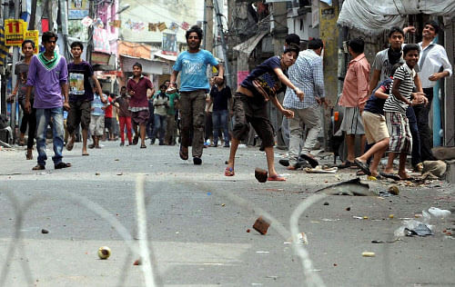 Protesters pelt stones at Army and security personnel after violence broke out during a protest against Kishtwar communal clashes in Jammu. PTI FIle Image