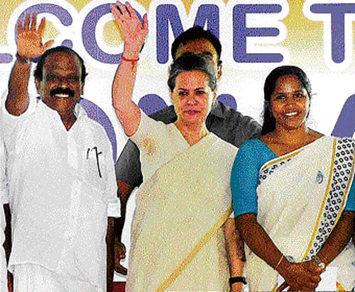 Congress president Sonia Gandhi waves to people at an  election meeting in Thrissur on Monday. pti