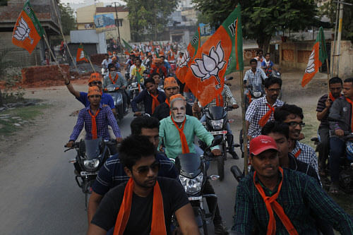 Thousands of BJP workers and supporters thronged the city streets today to catch a glimpse of the party's prime ministerial candidate Narendra Modi, who began his road show here before going to the collectorate to file nomination papers for the Lok Sabha polls. AP file photo