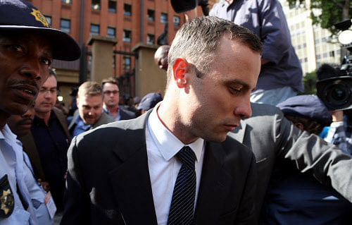 Oscar Pistorius returned to the witness stand today, giving horrifying testimony about his vain attempts to stem girlfriend Reeva Steenkamp's blood loss and save her life using plastic bags and utility tape. AP photo