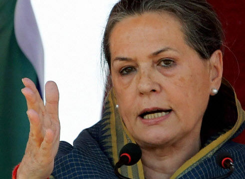 Training her guns on BJP's Prime Ministerial candidate Narendra Modi, Congress President Sonia Gandhi today charged that he was being projected with his true face hidden behind a mask and as a magician who could cure all ills of the country. PTI photo