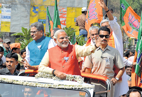 BJP's prime ministerial candidate Narendra Modi at a road show held in Vadodara on Wednesday. PHOTO&#8200;BY&#8200;PRAGNESH&#8200;VYAS
