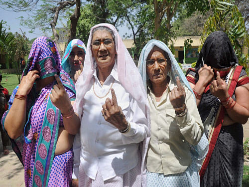 Security, inflation and stable government remained predominant issues weighing on women voters' minds in the national capital, which witnessed brisk polling today for seven of the Lok Sabha constituencies. PTI Photo