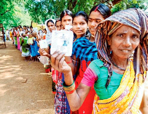 People wait in long queues to cast their votes at a polling station for Lok Sabha elections in Bastar, Chhattisgarh on Thursday. PTI Photo