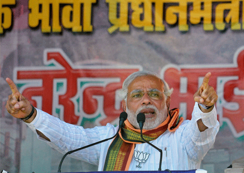 BJP prime ministerial candidate Narendra Modi addresses an election rally in Jehanabad on Thursday. Accusing Narendra Modi of misguiding people about his marital status for several years, the Gujarat unit of the Congress threatened to take legal action against him today, for providing false information in the affidavit submitted along with his nomination papers. PTI Photo