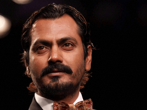 Actor Nawazuddin Siddiqui believes he looks 'dull', but has still managed to carve a niche in the Hindi film industry. He says good looks may guarantee a hero's spot, but not acting skills. PTI Photo