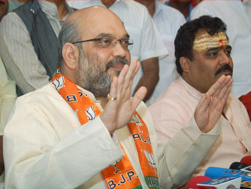 Cracking the whip on Narendra Modi's close aide Amit Shah and SP leader Azam Khan, the Election Commission today banned them from holding public meetings, processions or roadshows in Uttar Pradesh and asked authorities to initiate criminal proceedings against them. PTI File Photo