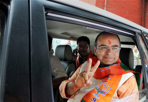 BJP candidate Arun Jaitley shows victory sign as he leaves after filing his nomination papers in Amritsar on Monday. PTI Photo
