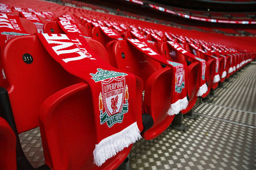 Ninety-six Liverpool scarves are placed on seats on the 25th anniversary of the Hillsborough disaster before the FA Cup semi-final soccer match between Arsenal and Wigan Athletic at Wembley Stadium in London April 12, 2014. Every senior match in England will kick-off seven minutes later than normal this weekend as soccer marks the 25th anniversary of the Hillsborough disaster, when 96 Liverpool fans died at an FA Cup semi-final against Nottingham Forest. REUTERS